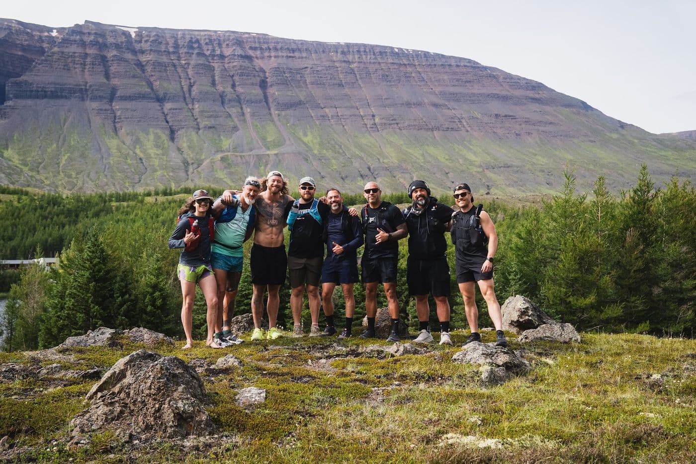 The whole expedition crew with a mountain backdrop