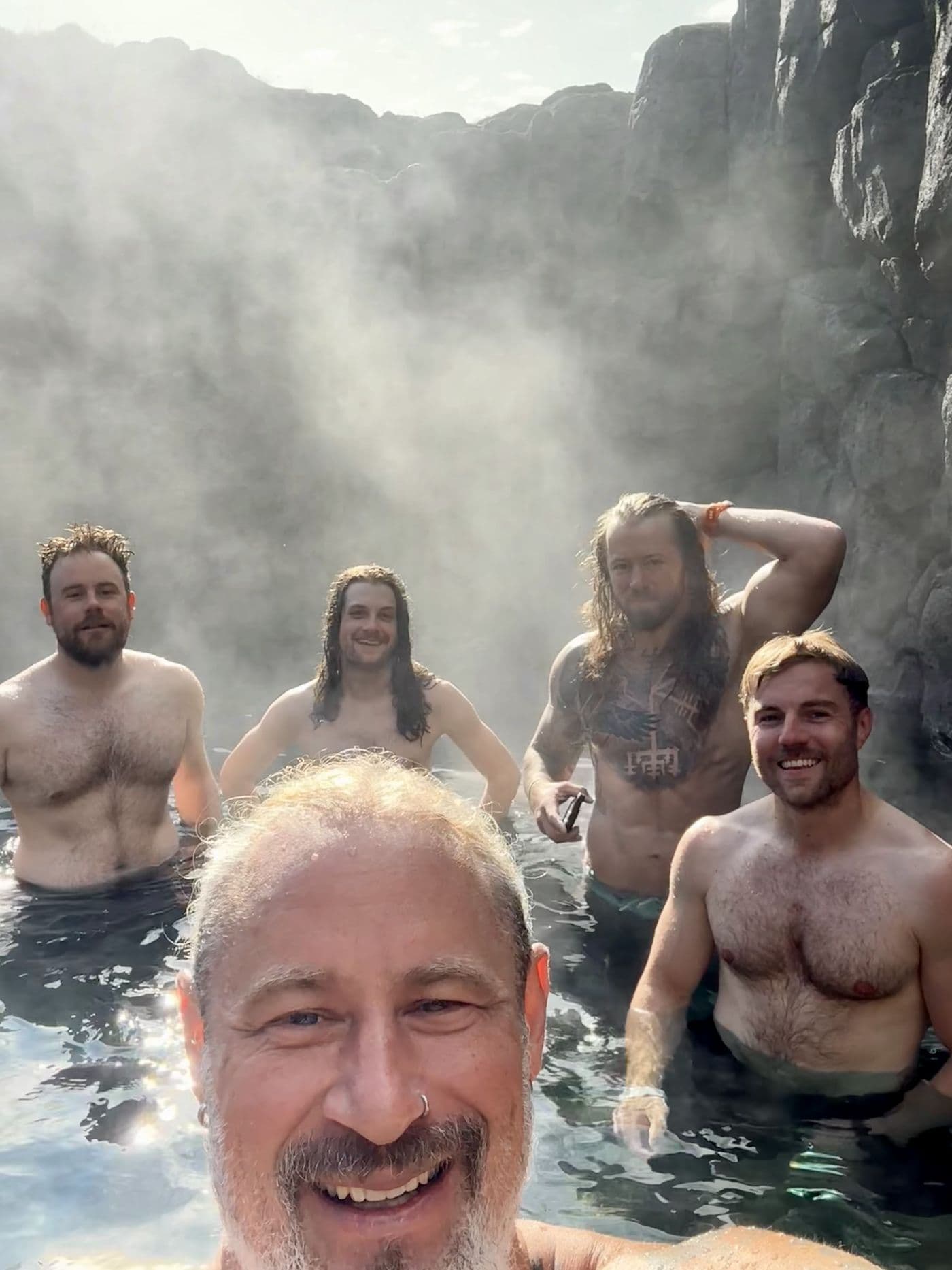 The crew soaking in a geothermal hot spring after a stage