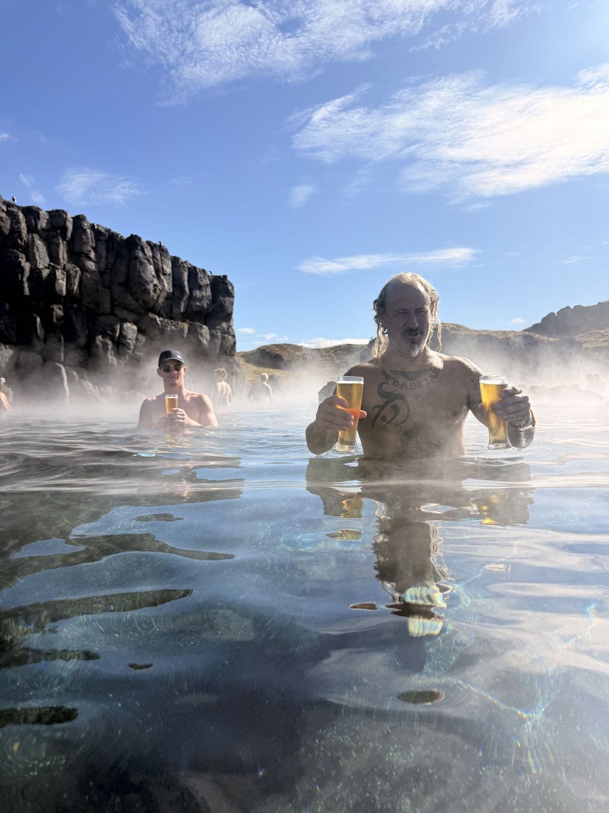 The crew soaking in a steaming geothermal lagoon after the finish