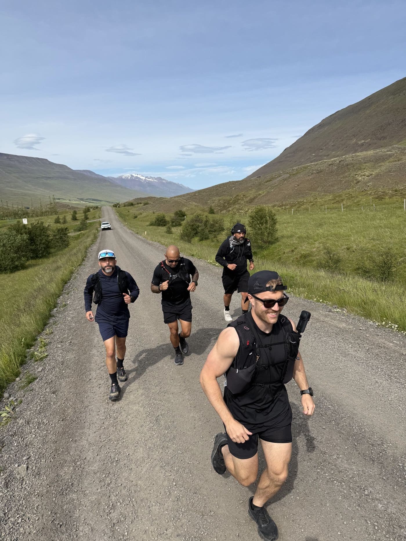 Justin's crew running together down a gravel highland road
